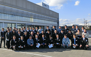 Participants in front of Chugai Pharmaceutical Manufacturing's state-of-the-art plant
